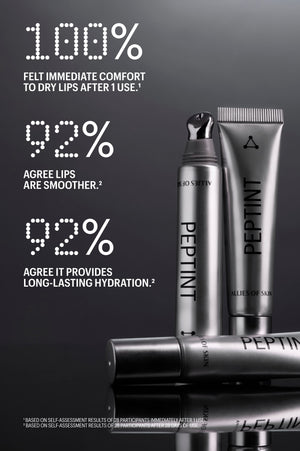 Three silver cosmetic tubes and a bottle labeled PEPTINT are arranged on a dark reflective surface with large white marketing text about dry lips and smoother lips.